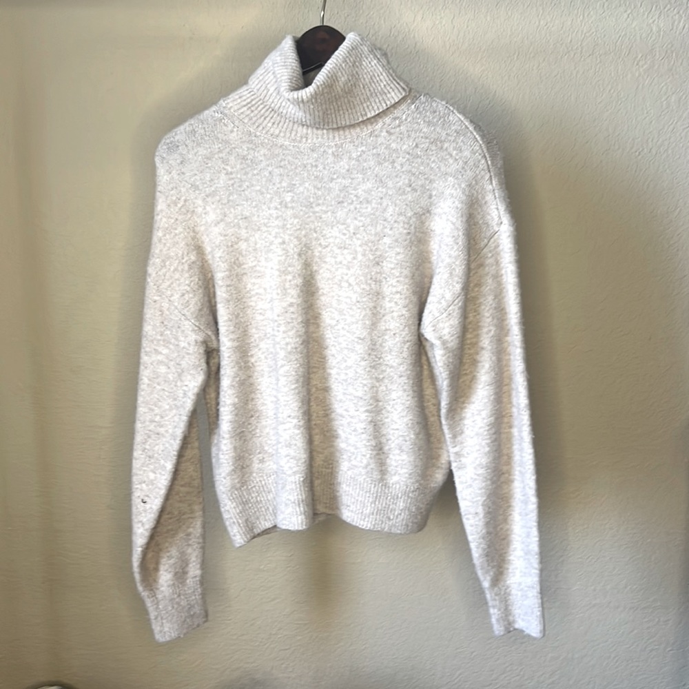 tan turtleneck sweater